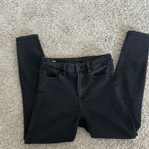 AE black busted knee skinny jeans